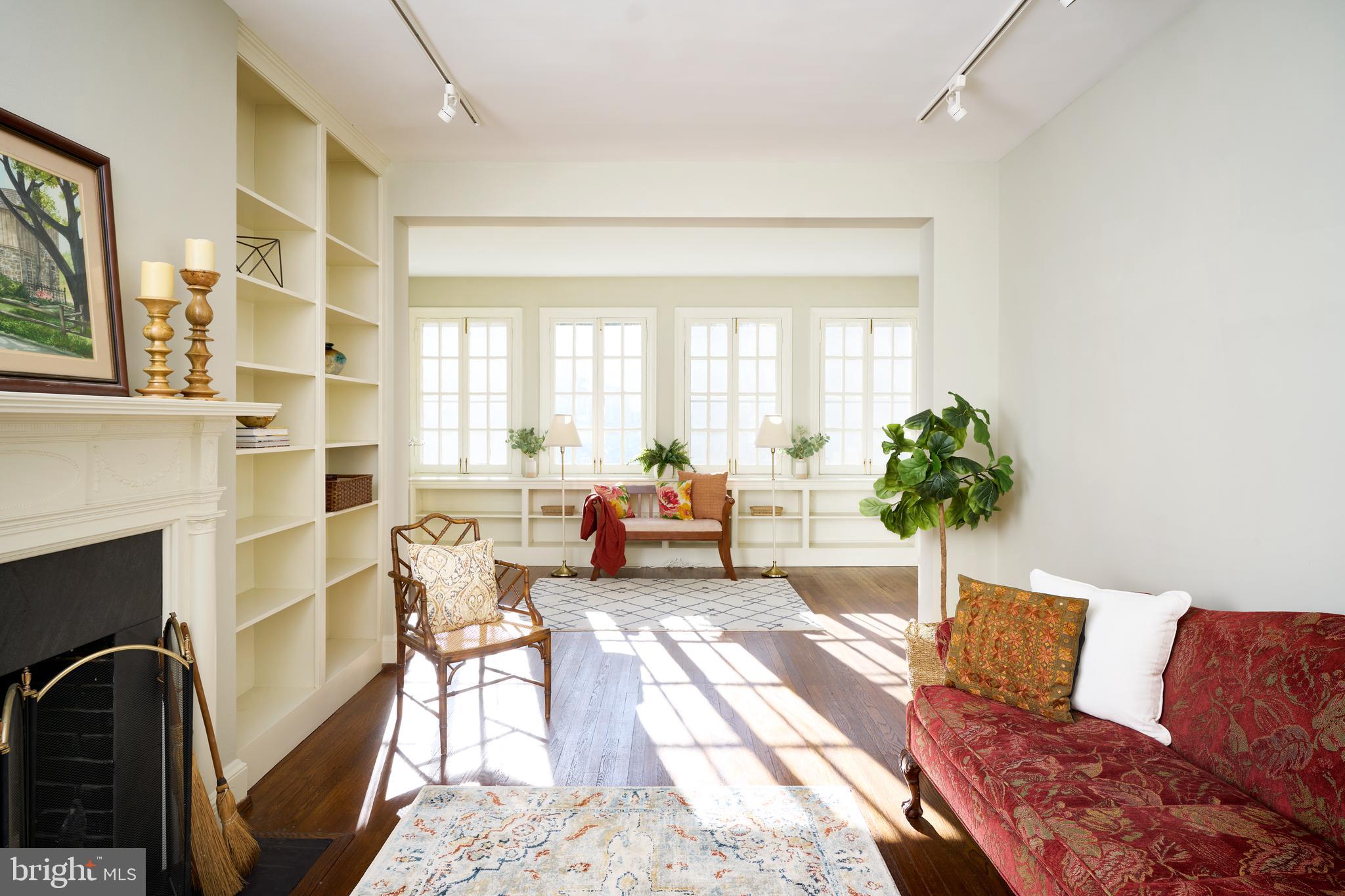 221 Stony Run Lane, Unit J2 Baltimore, MD 21210 - Photo 1 of 31 a living room with furniture and a large window