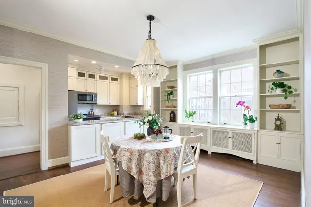 a dining room with furniture and window
