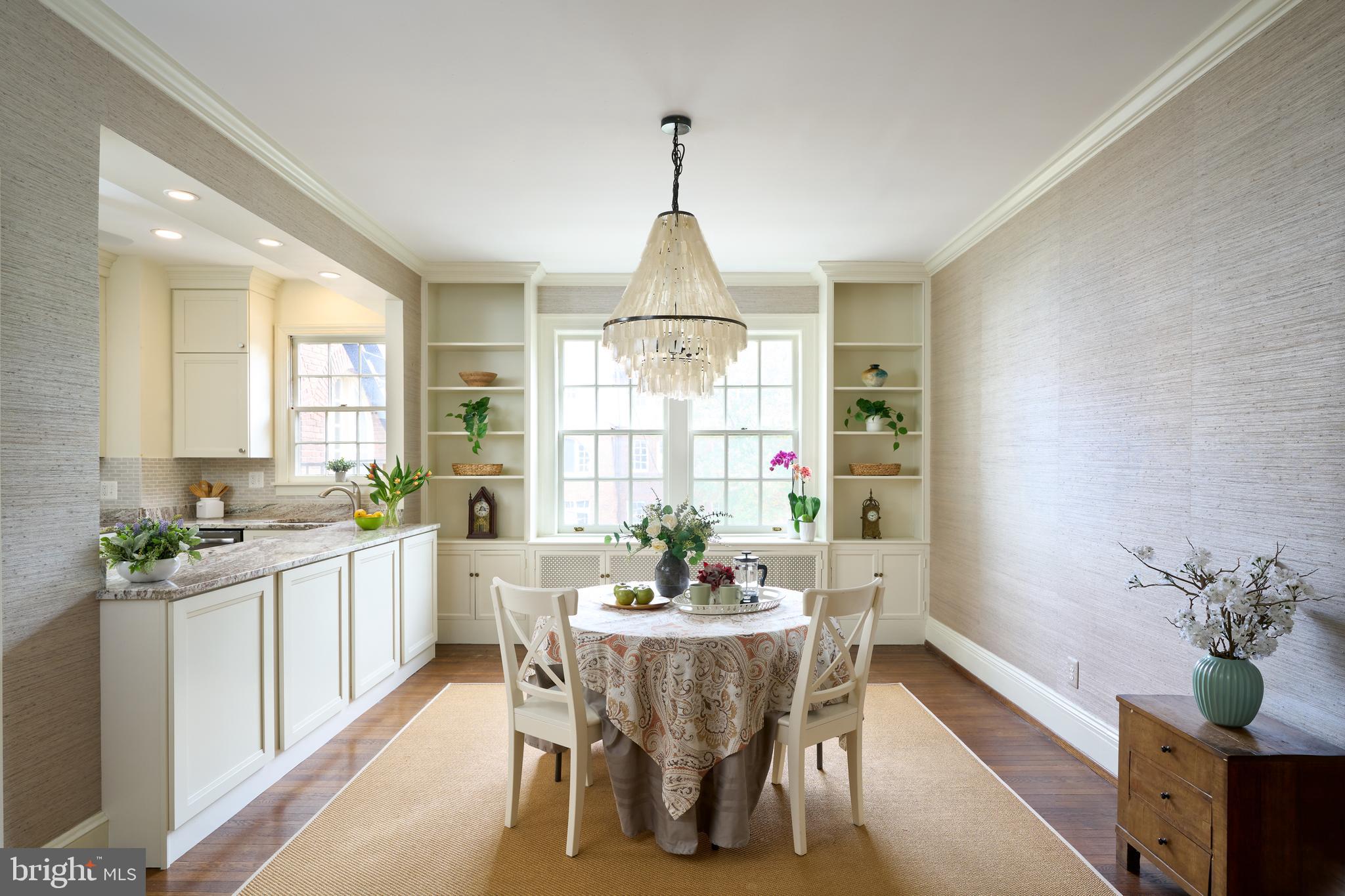 221 Stony Run Lane, Unit J2 Baltimore, MD 21210 - Photo 12 of 31 a dining room with furniture window and wooden floor