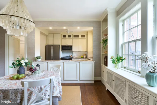 a large kitchen with kitchen island granite countertop lots of counter top space and stainless steel appliances