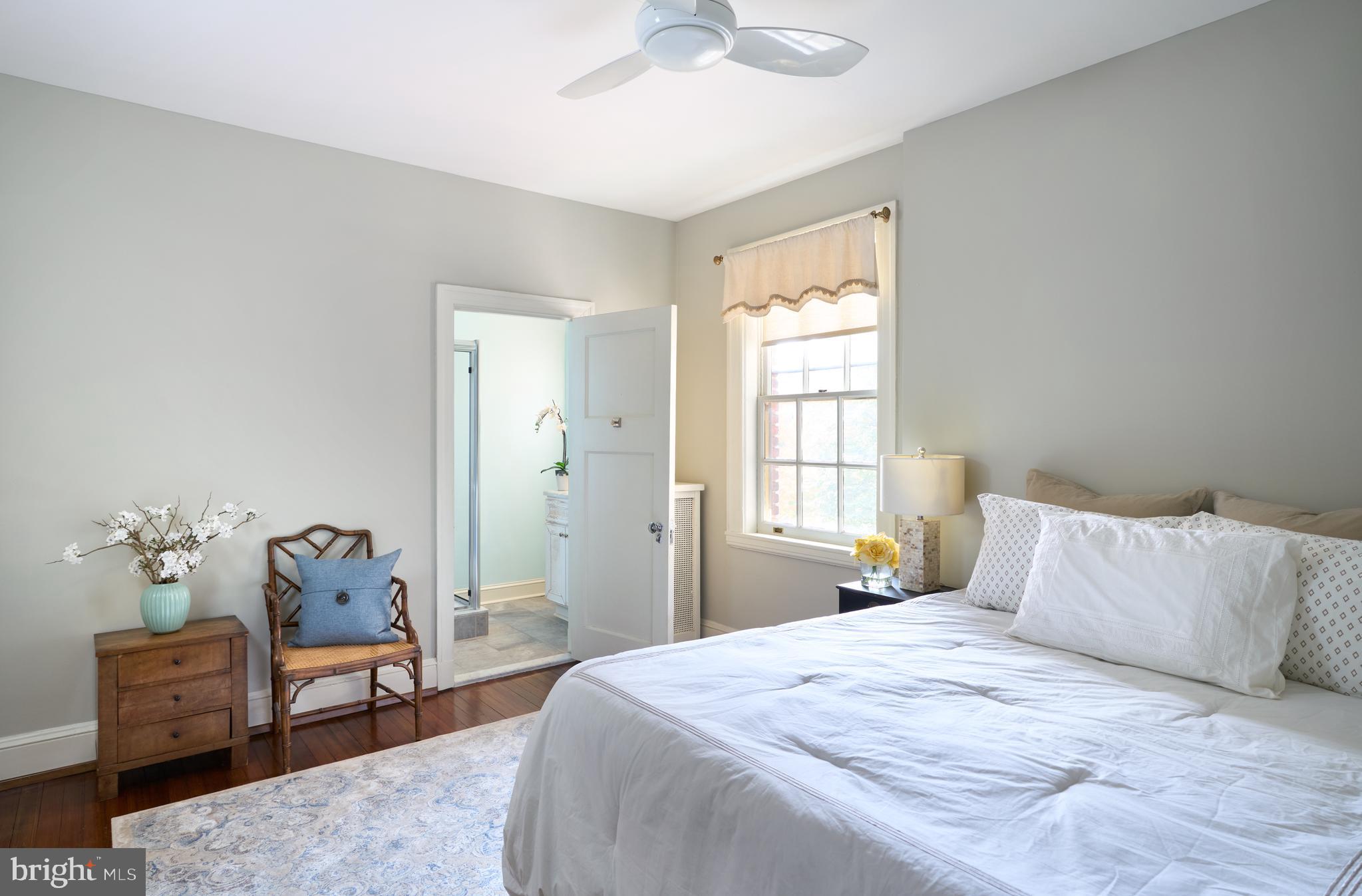 221 Stony Run Lane, Unit J2 Baltimore, MD 21210 - Photo 18 of 31 a bedroom with a bed and window