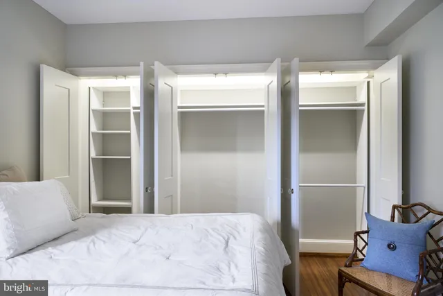 a bedroom with bed and window