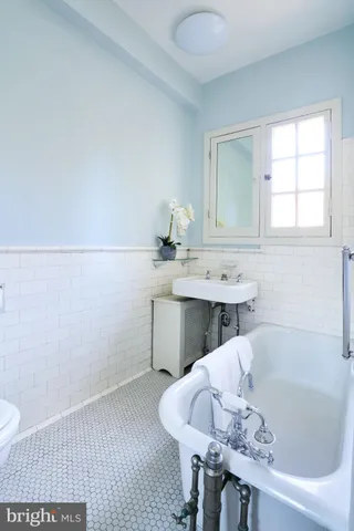 a bathroom with a bathtub and a sink