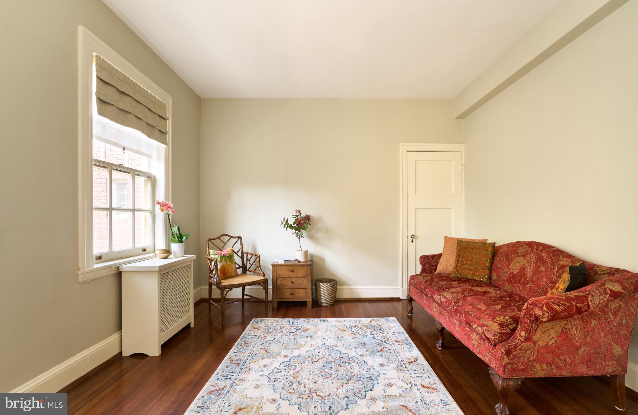 221 Stony Run Lane, Unit J2 Baltimore, MD 21210 - Photo 27 of 31 a living room with furniture and a window