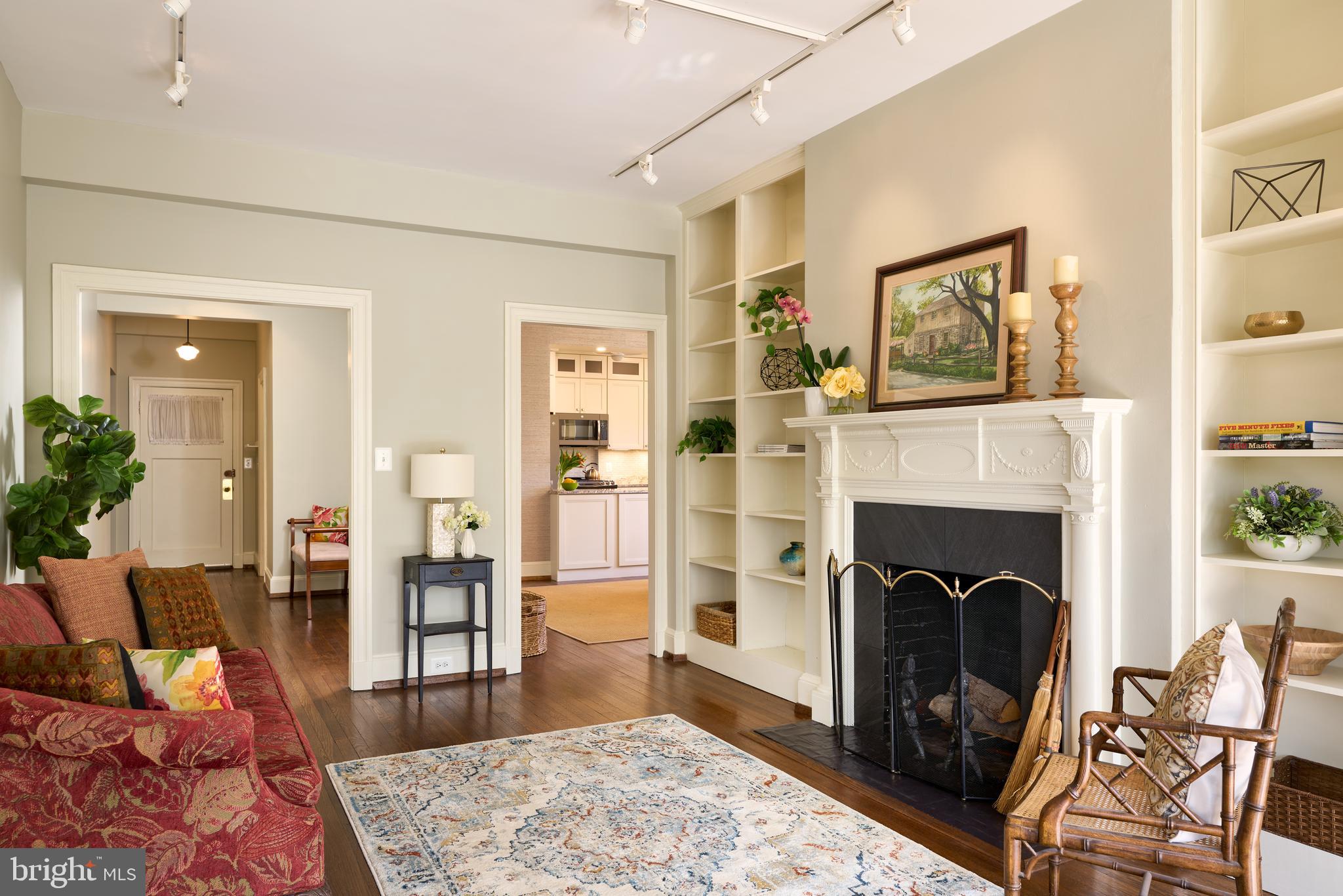 221 Stony Run Lane, Unit J2 Baltimore, MD 21210 - Photo 3 of 31 a living room with furniture and a fireplace