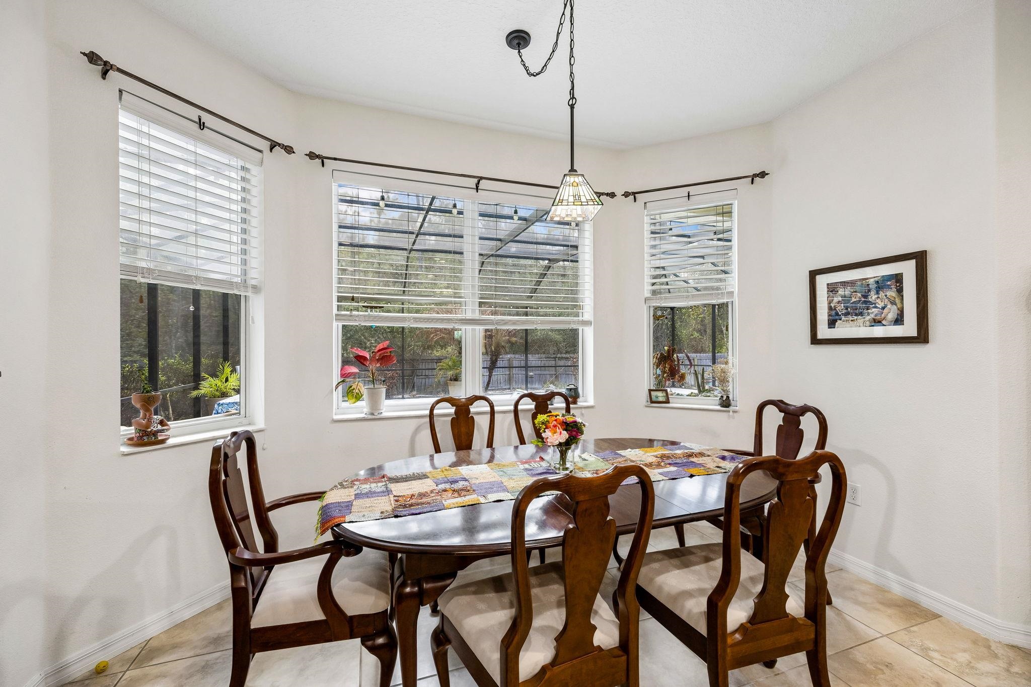 133 South Twin Maple Road St. Augustine, FL 32084 - Photo 11 of 34 Dining area featuring light tile patterned floors