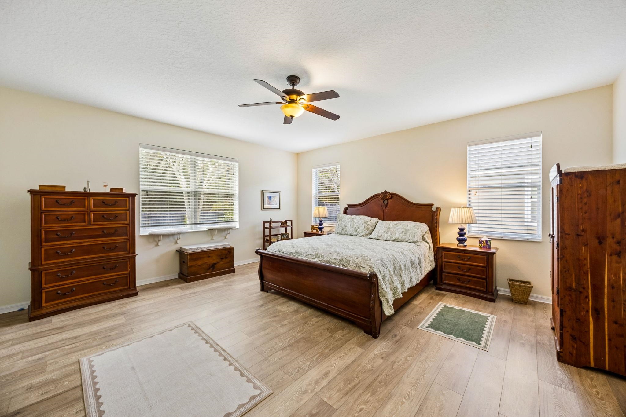 133 South Twin Maple Road St. Augustine, FL 32084 - Photo 13 of 34 Bedroom featuring a ceiling fan and light wood-type flooring