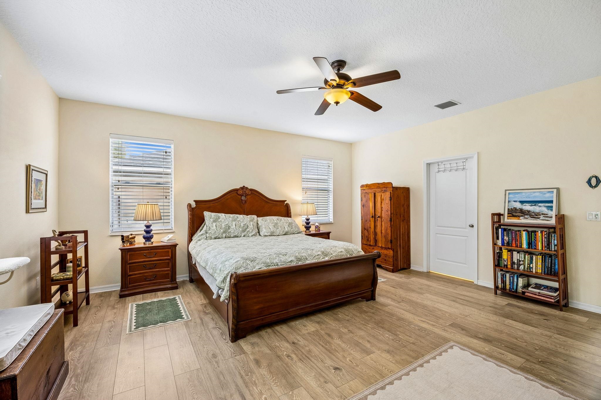 133 South Twin Maple Road St. Augustine, FL 32084 - Photo 14 of 34 Bedroom featuring a ceiling fan, light wood-style floors, and a textured ceiling