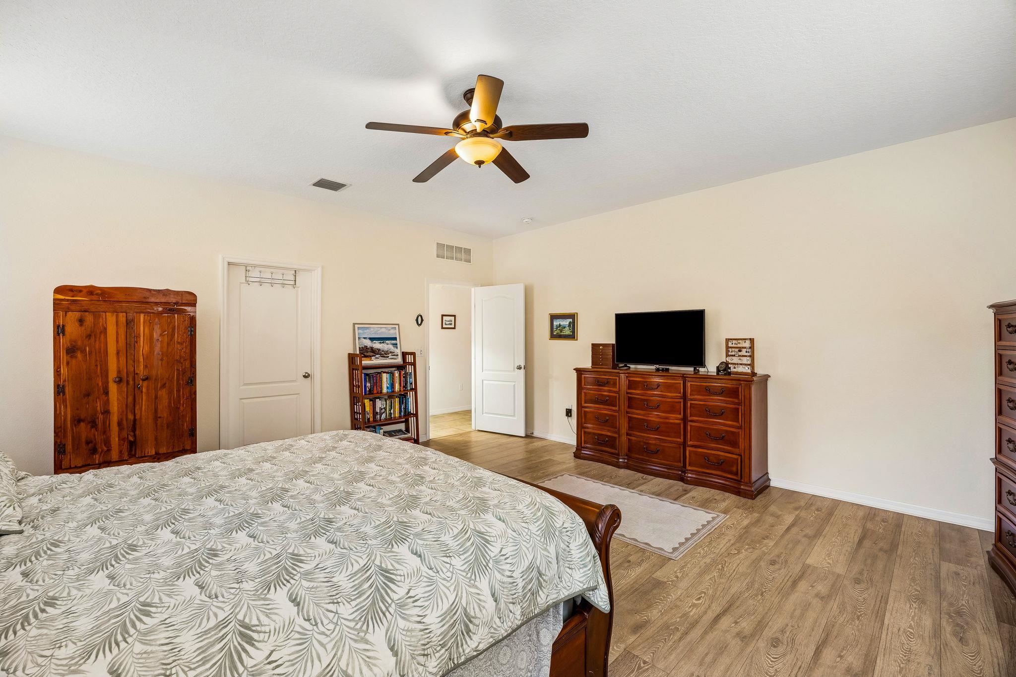 133 South Twin Maple Road St. Augustine, FL 32084 - Photo 15 of 34 Bedroom with light wood-type flooring and a ceiling fan