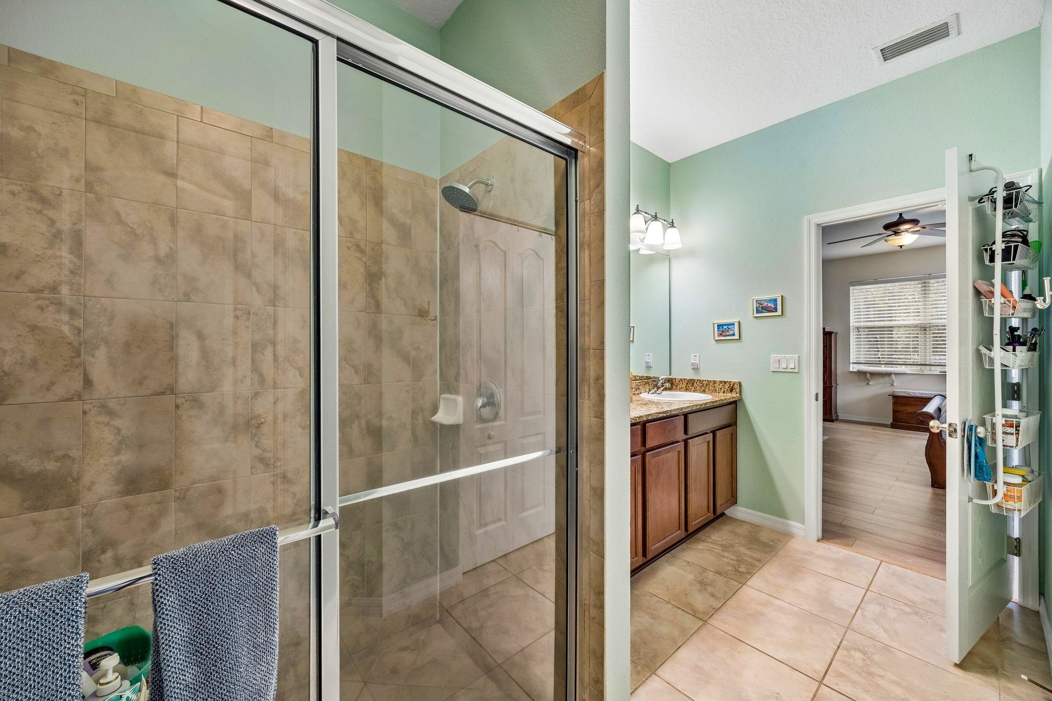 133 South Twin Maple Road St. Augustine, FL 32084 - Photo 16 of 34 a bathroom with a shower and a sink