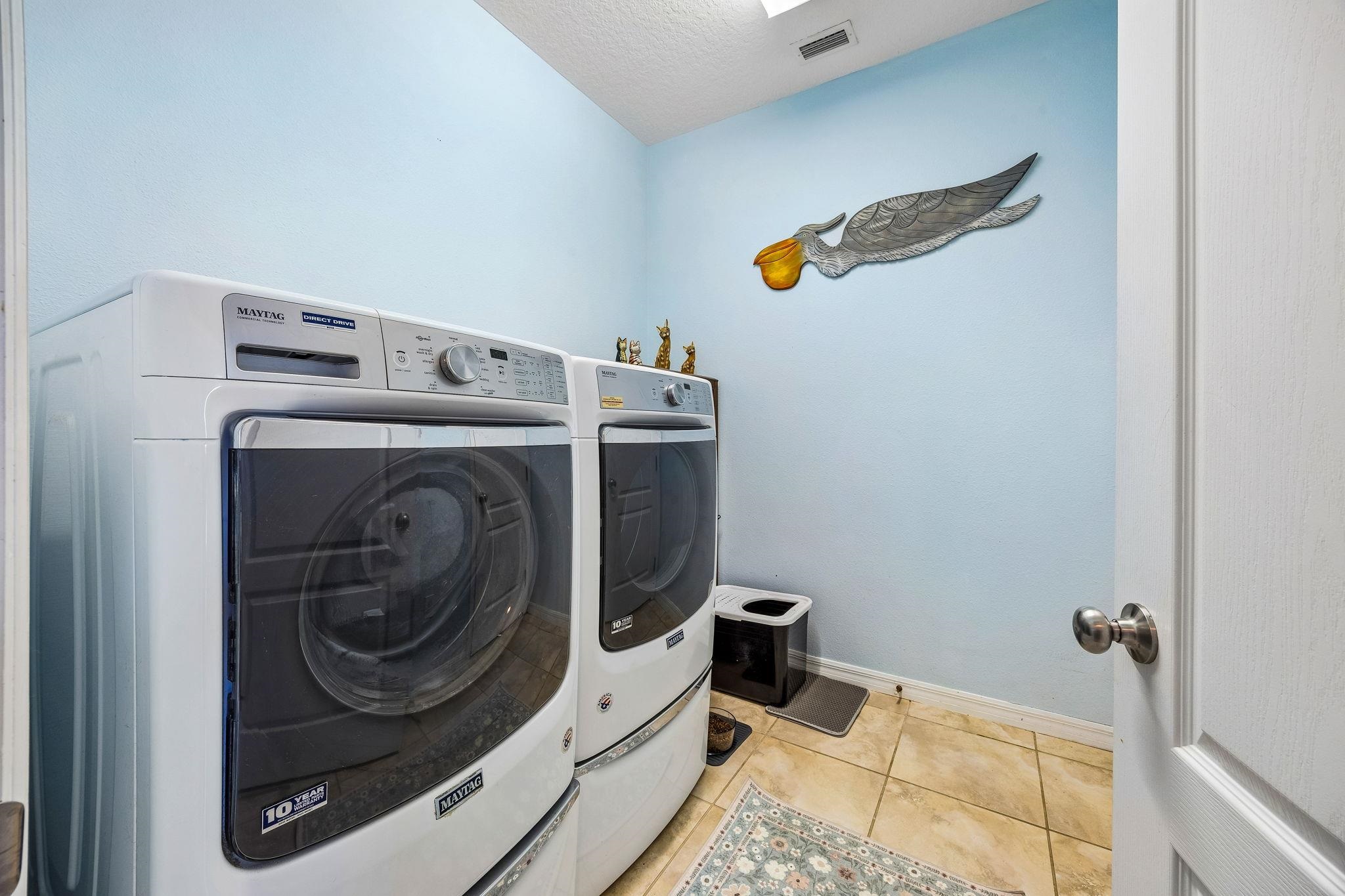133 South Twin Maple Road St. Augustine, FL 32084 - Photo 24 of 34 a utility room with dryer and washer