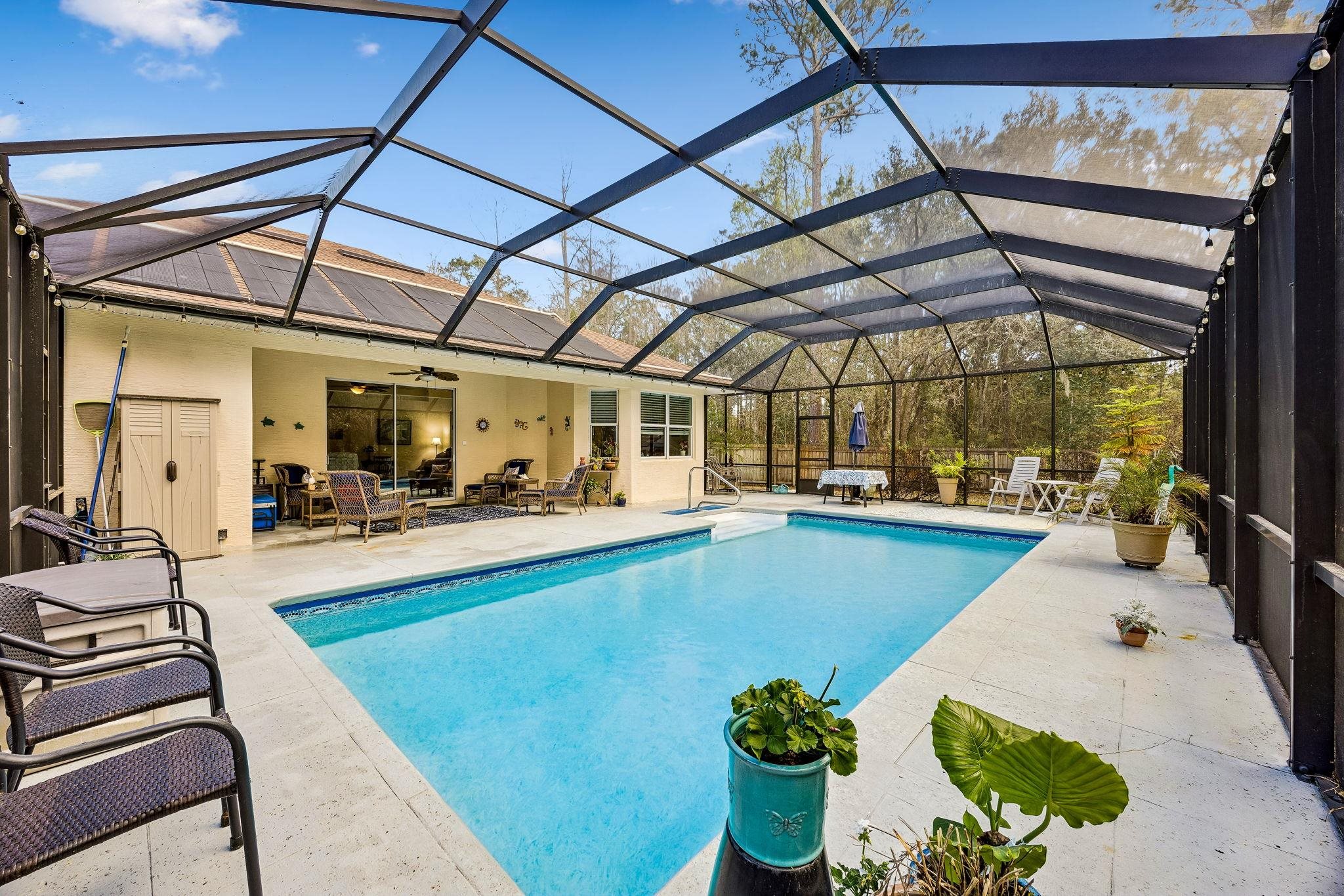 133 South Twin Maple Road St. Augustine, FL 32084 - Photo 27 of 34 a view of swimming pool with outdoor seating