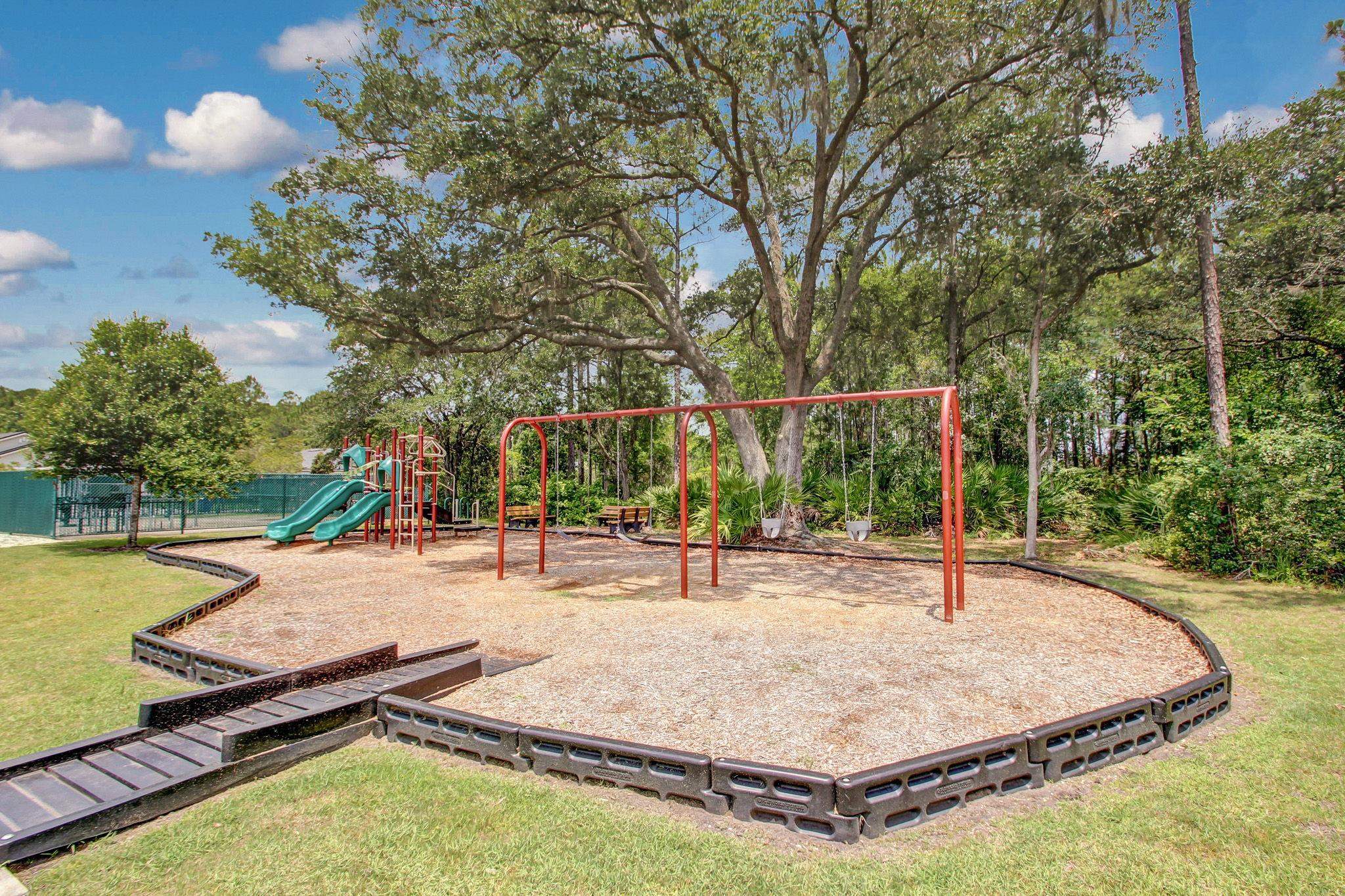 133 South Twin Maple Road St. Augustine, FL 32084 - Photo 31 of 34 Community jungle gym featuring a yard