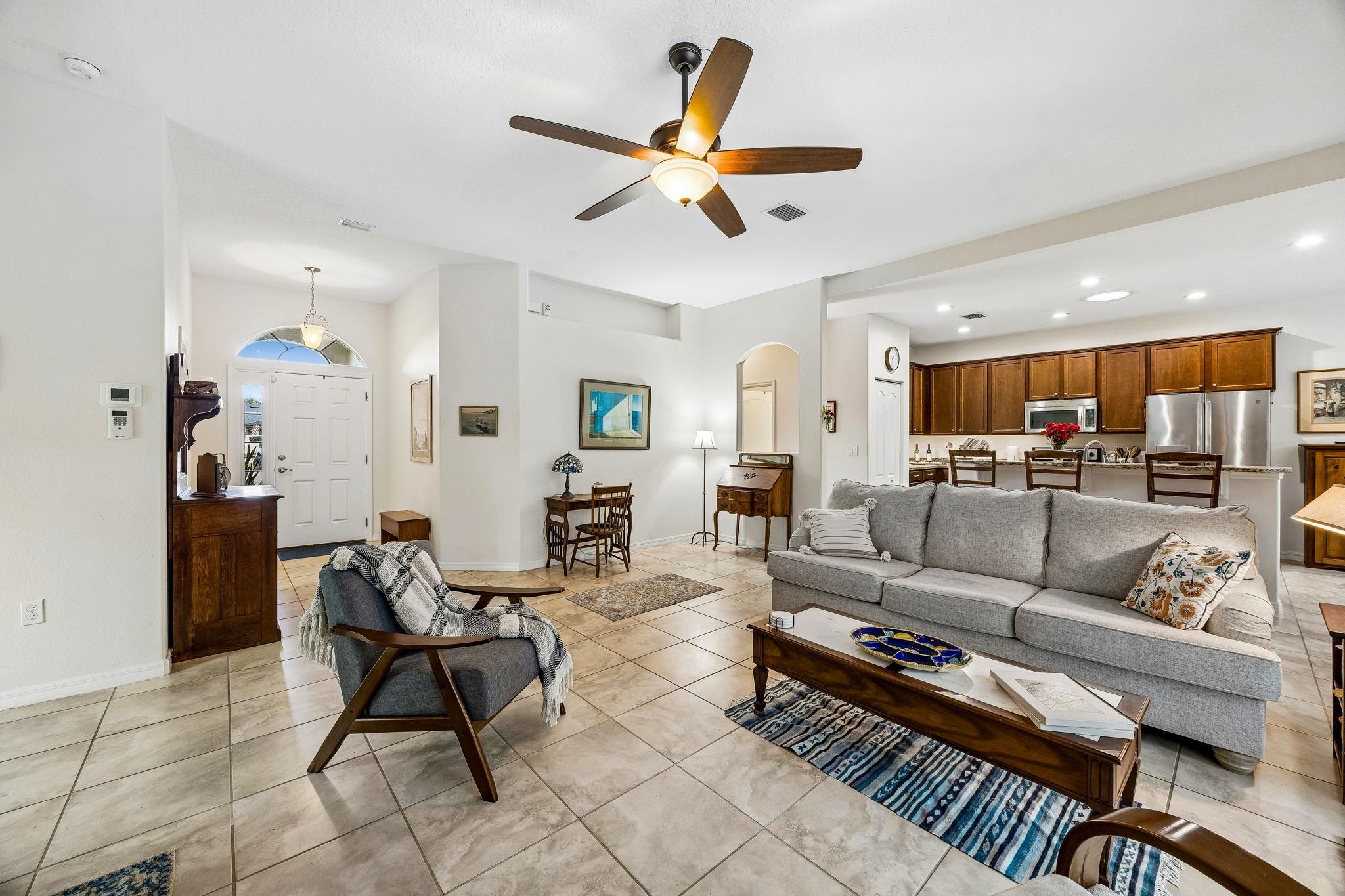 133 South Twin Maple Road St. Augustine, FL 32084 - Photo 6 of 34 Living room with recessed lighting, a ceiling fan, arched walkways, and light tile patterned flooring