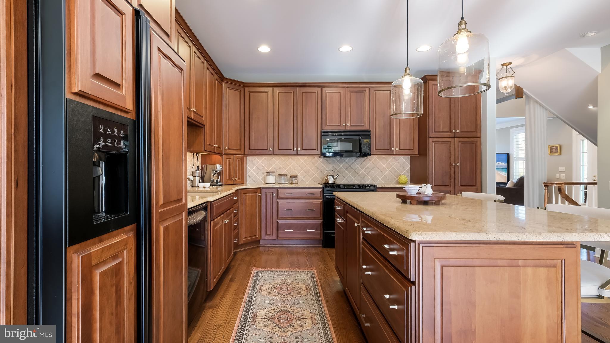 12 Garden Path Doylestown, PA 18901 - Photo 15 of 58 a kitchen with a sink stove and cabinets