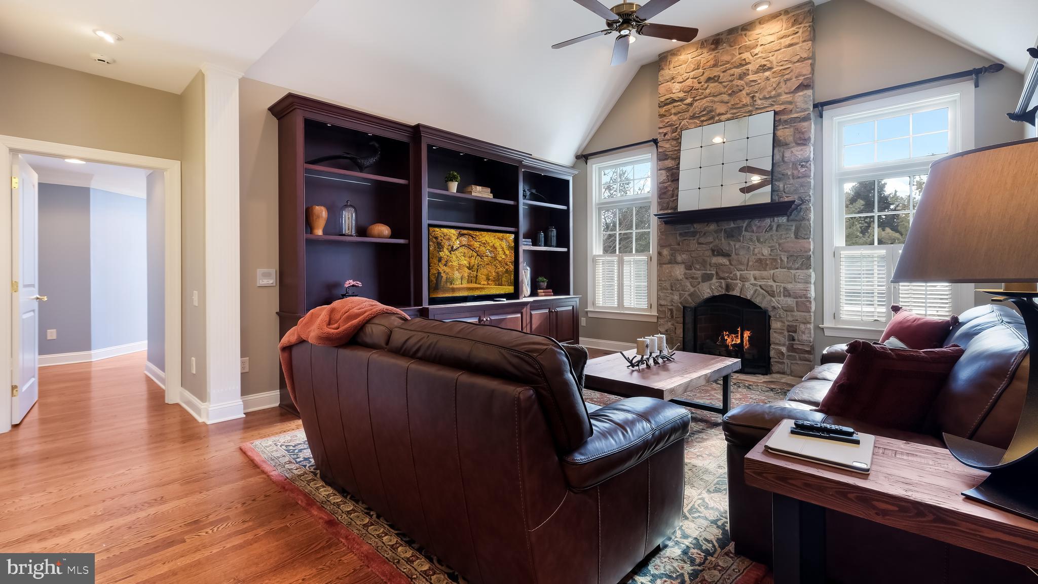 12 Garden Path Doylestown, PA 18901 - Photo 22 of 58 a living room with furniture and a fireplace