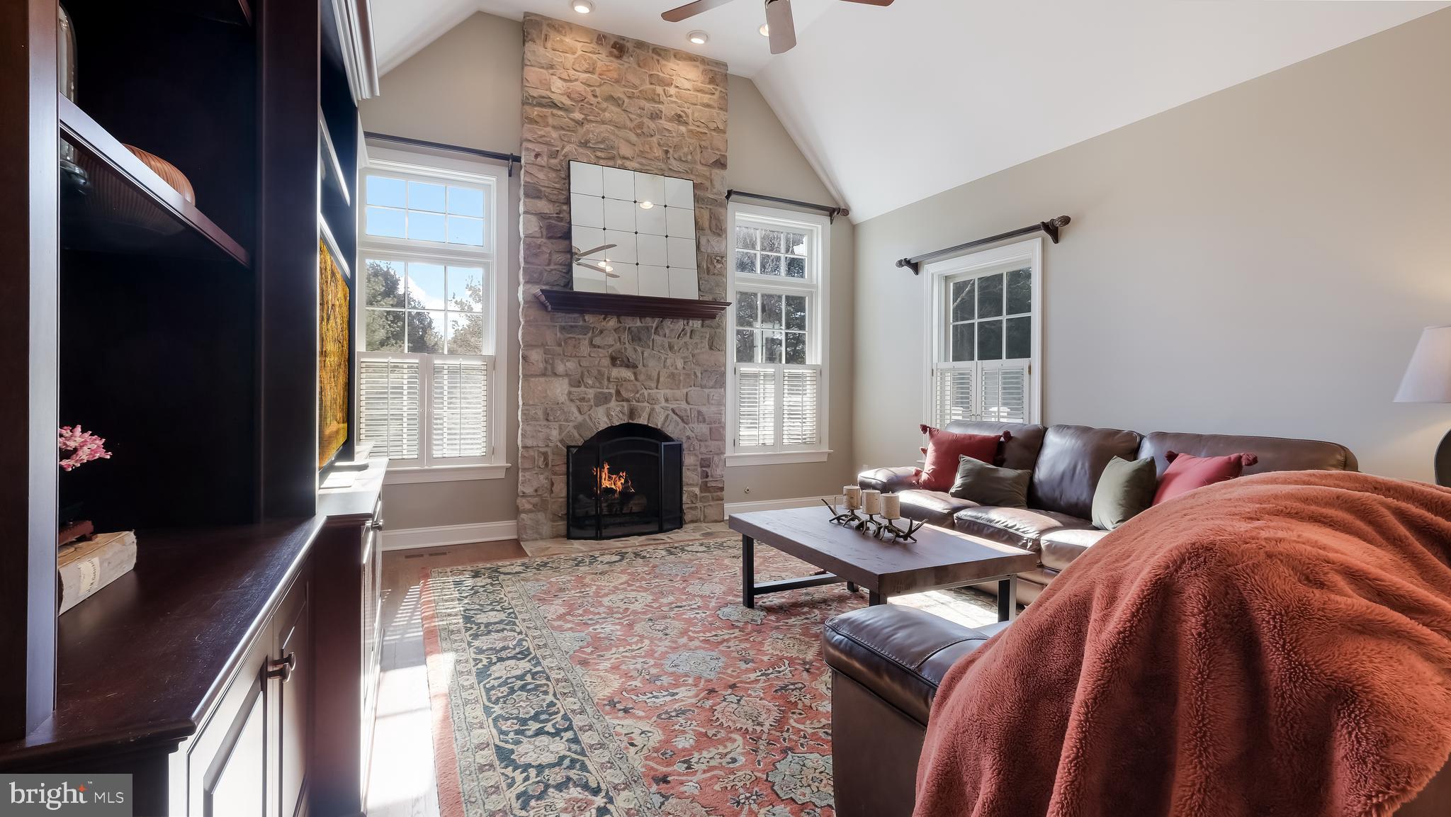 12 Garden Path Doylestown, PA 18901 - Photo 23 of 58 a living room with furniture and a fireplace