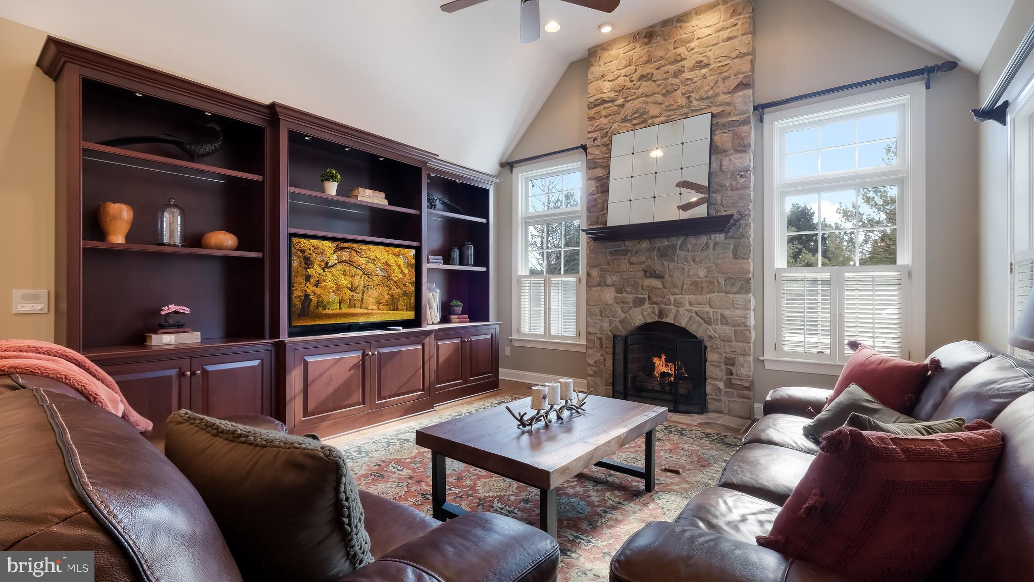 12 Garden Path Doylestown, PA 18901 - Photo 24 of 58 a living room with furniture and a fireplace