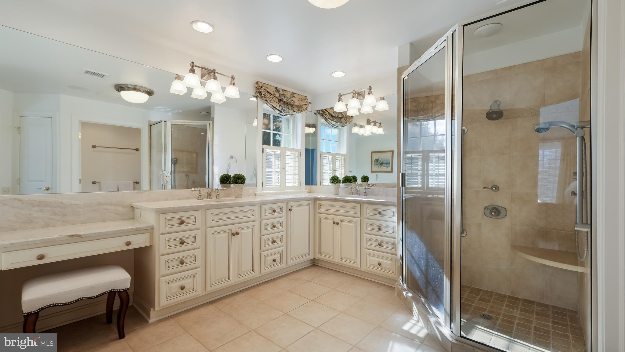 12 Garden Path Doylestown, PA 18901 - Photo 28 of 58 a spacious bathroom with a granite countertop sink mirror and shower