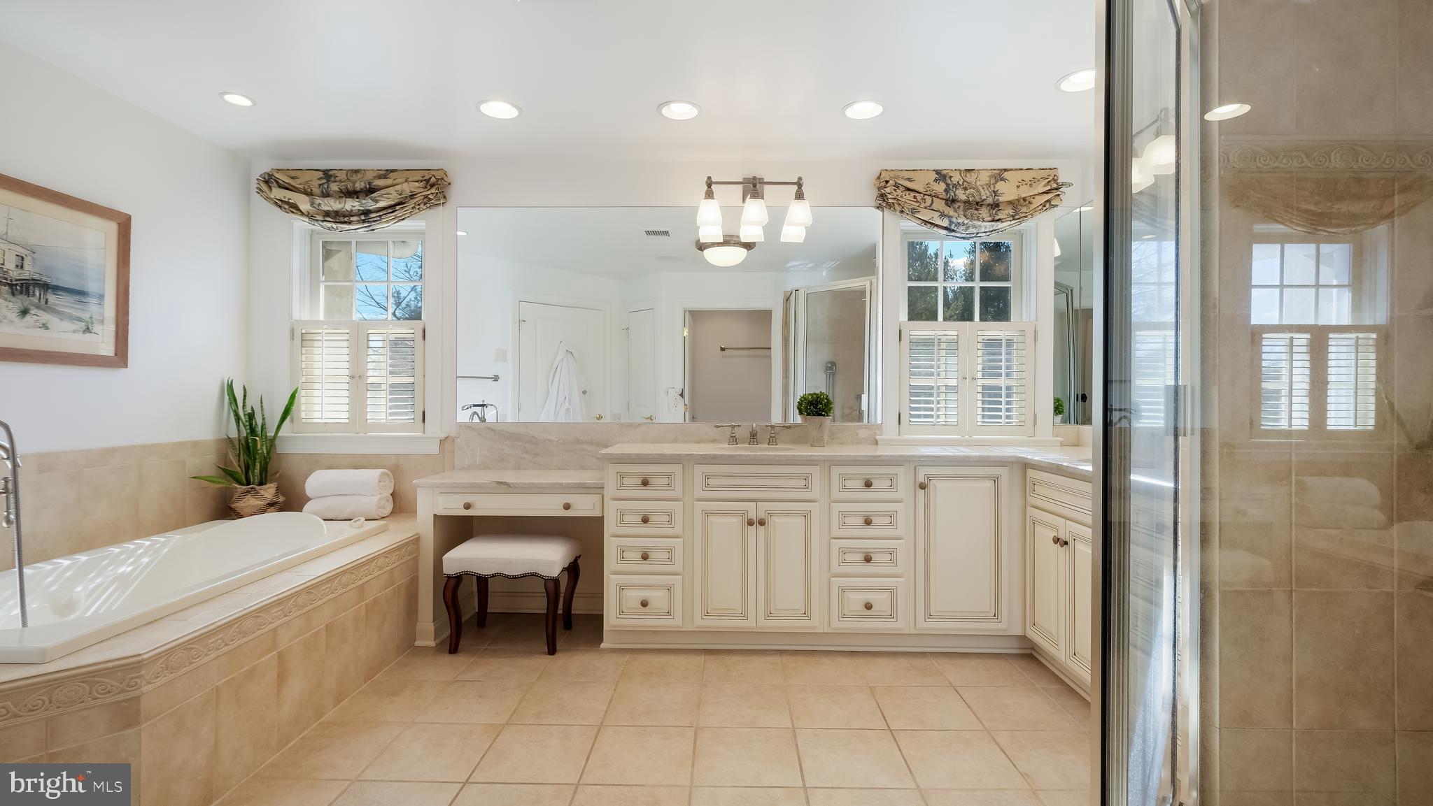 12 Garden Path Doylestown, PA 18901 - Photo 29 of 58 a spacious bathroom with a granite countertop sink mirror and bathtub