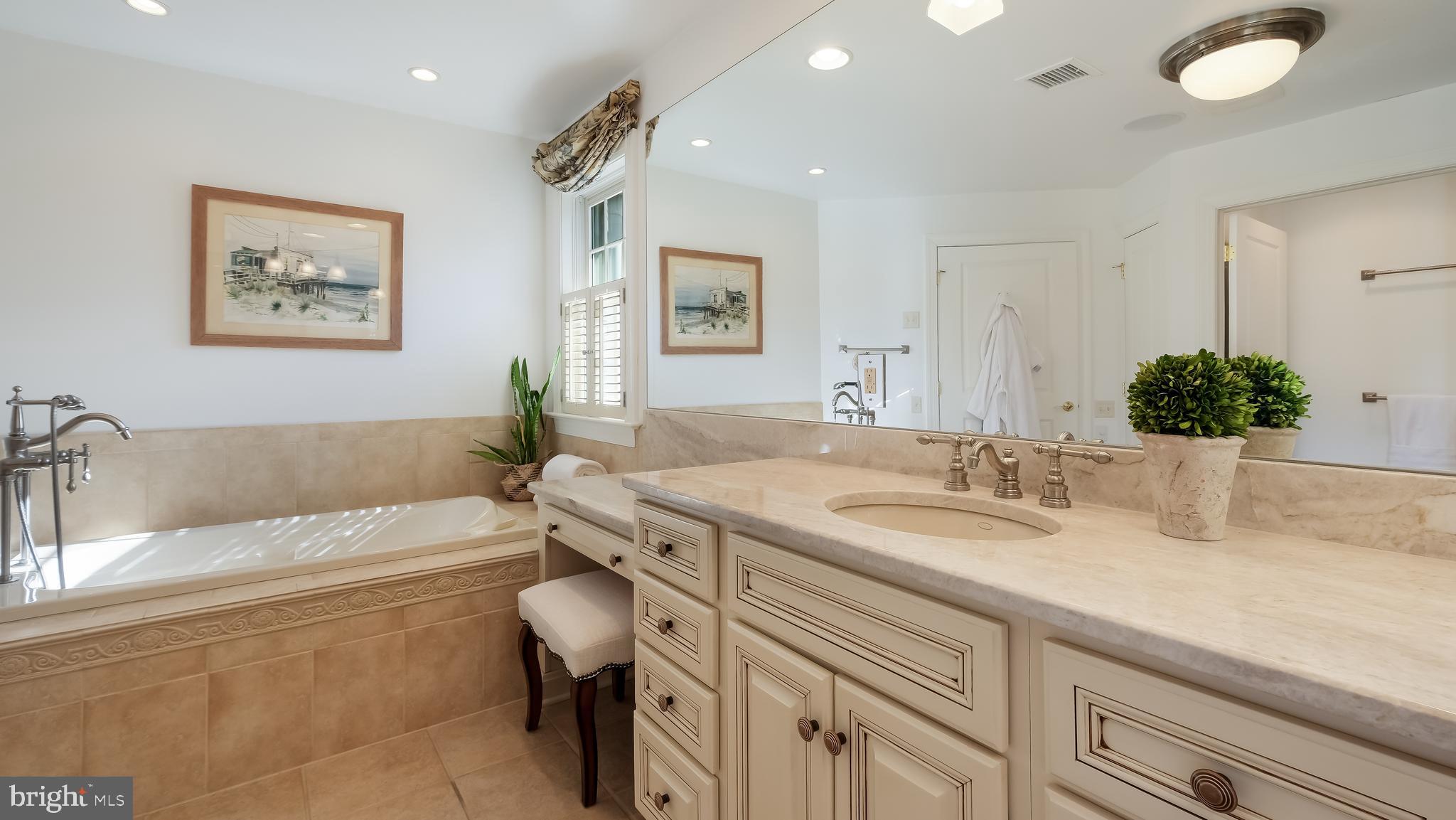 12 Garden Path Doylestown, PA 18901 - Photo 30 of 58 a bathroom with a granite countertop sink a toilet a mirror and bathtub