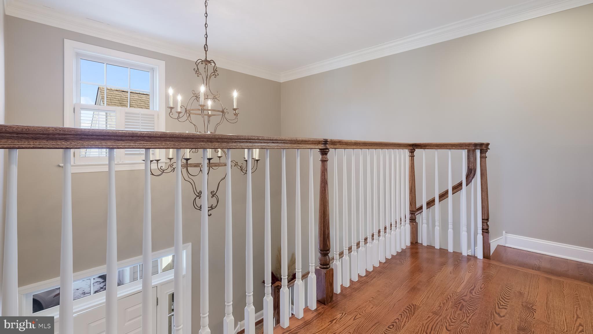 12 Garden Path Doylestown, PA 18901 - Photo 32 of 58 a view of a hallway with wooden floor and stairs