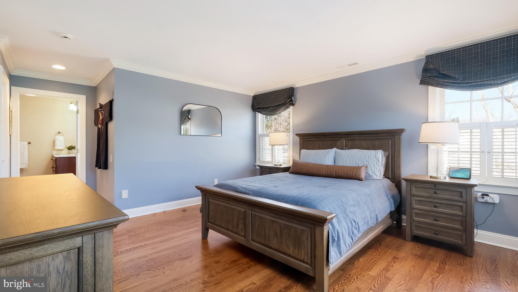 12 Garden Path Doylestown, PA 18901 - Photo 38 of 58 a bedroom with a bed and wooden floor