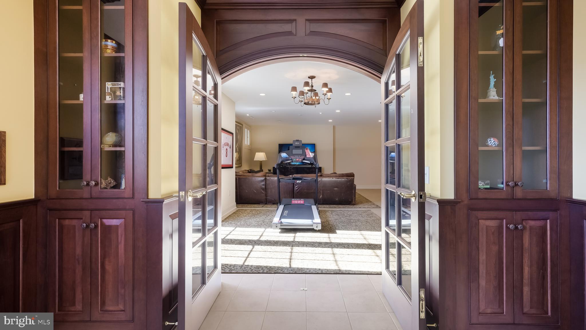 12 Garden Path Doylestown, PA 18901 - Photo 42 of 58 a view of a hallway with a large mirror on a dresser