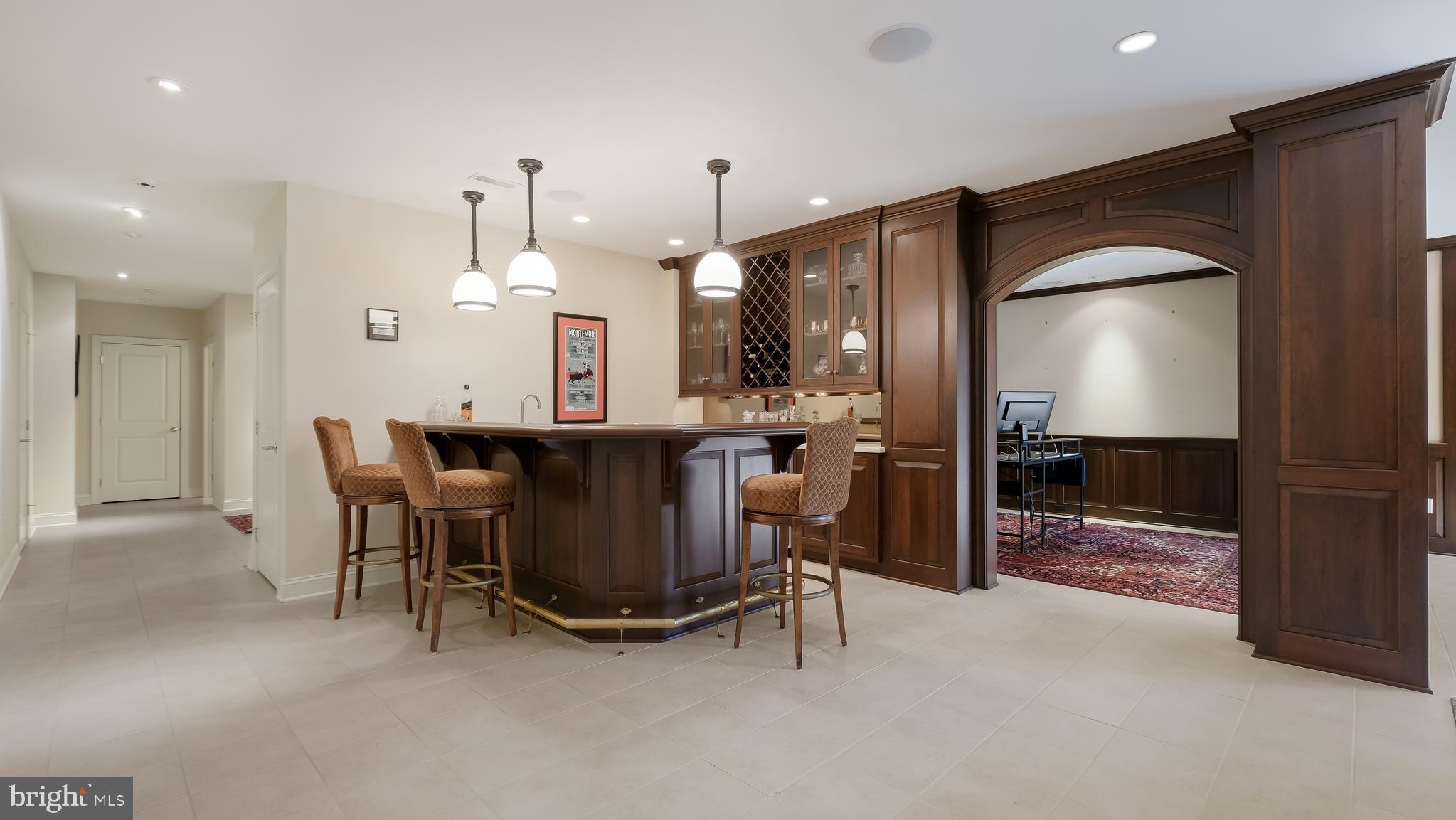 12 Garden Path Doylestown, PA 18901 - Photo 43 of 58 a dining room with furniture and a chandelier