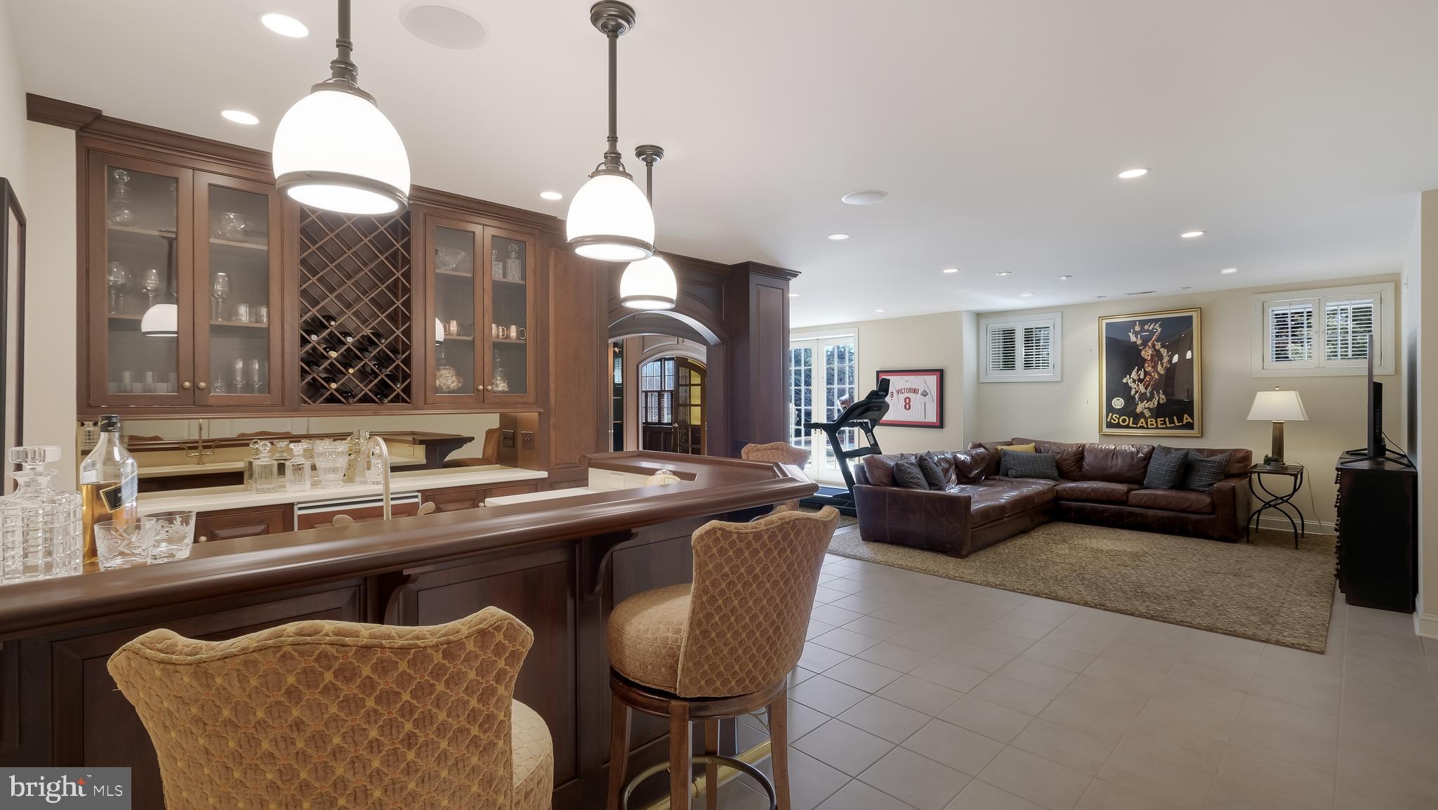 12 Garden Path Doylestown, PA 18901 - Photo 44 of 58 a living room with furniture a chandelier and a rug