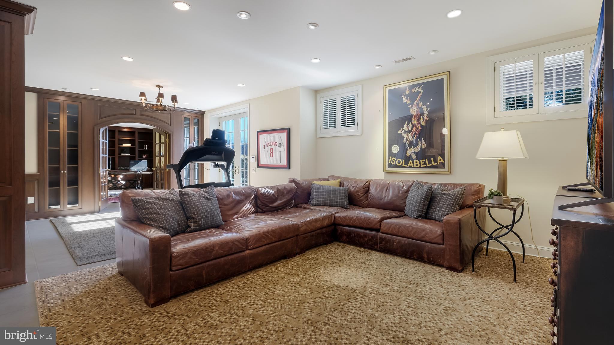 12 Garden Path Doylestown, PA 18901 - Photo 45 of 58 a living room with furniture and a lamp