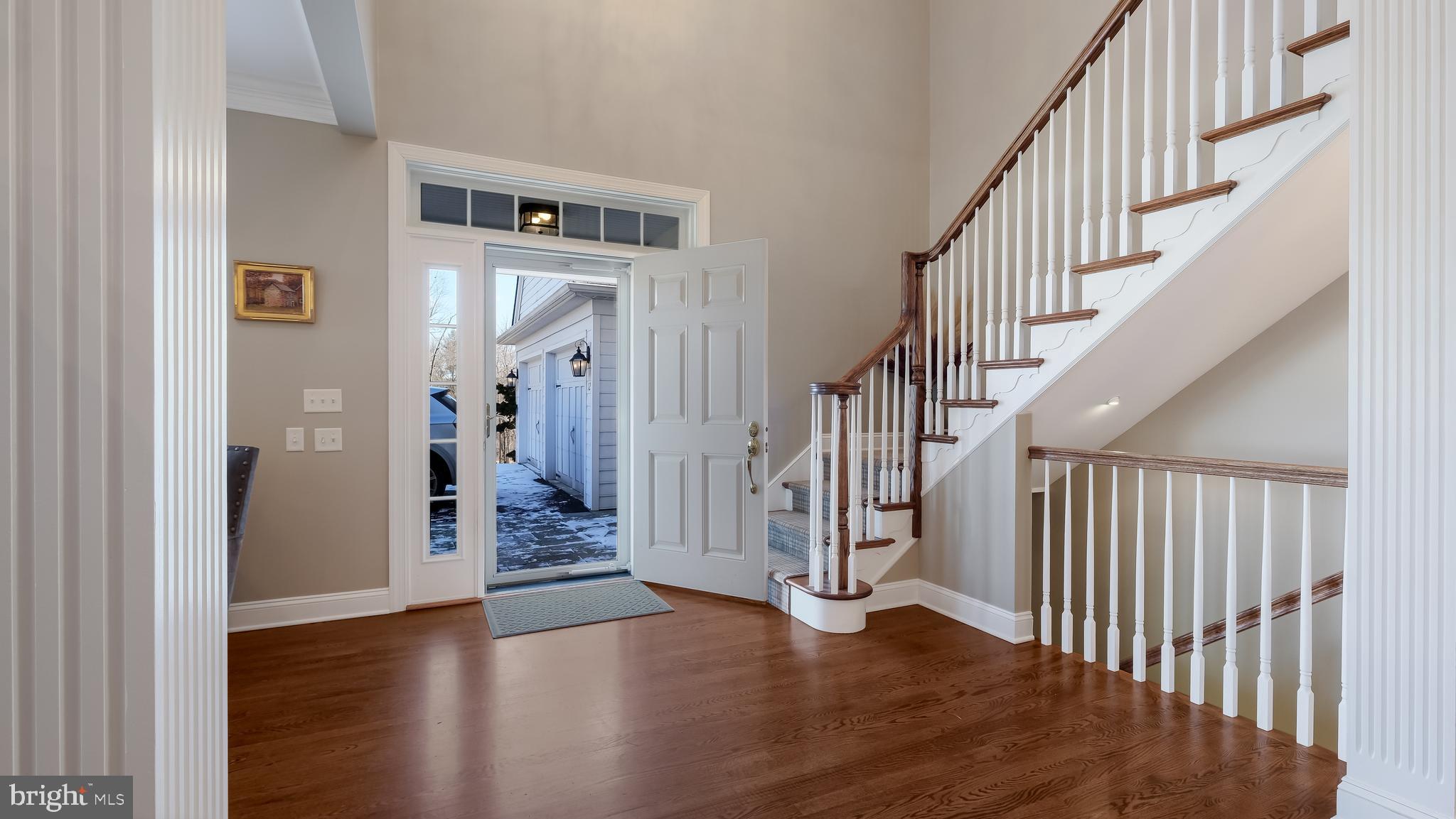 12 Garden Path Doylestown, PA 18901 - Photo 5 of 58 a view of an entryway with wooden floor and stairs