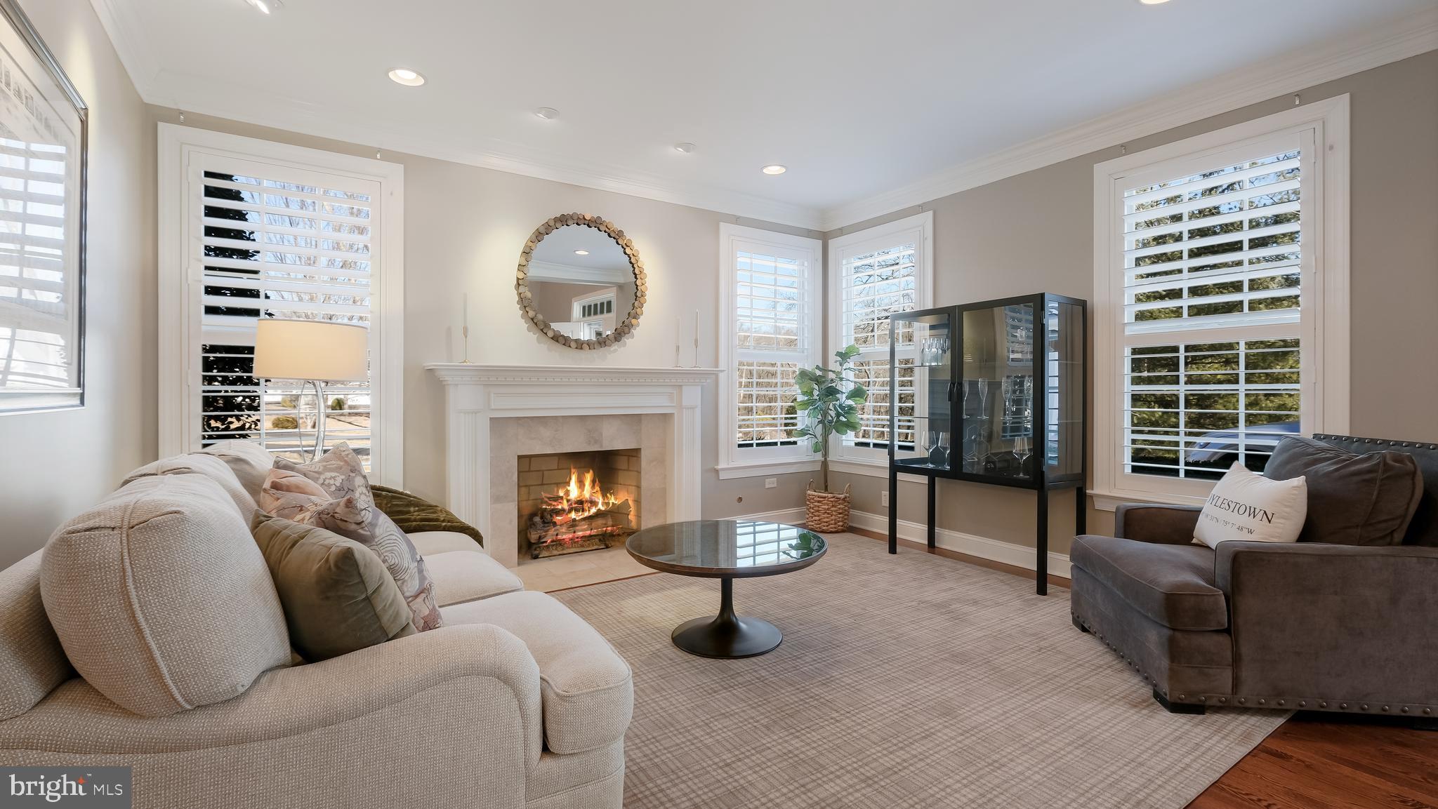 12 Garden Path Doylestown, PA 18901 - Photo 8 of 58 a living room with furniture a fireplace and a large window