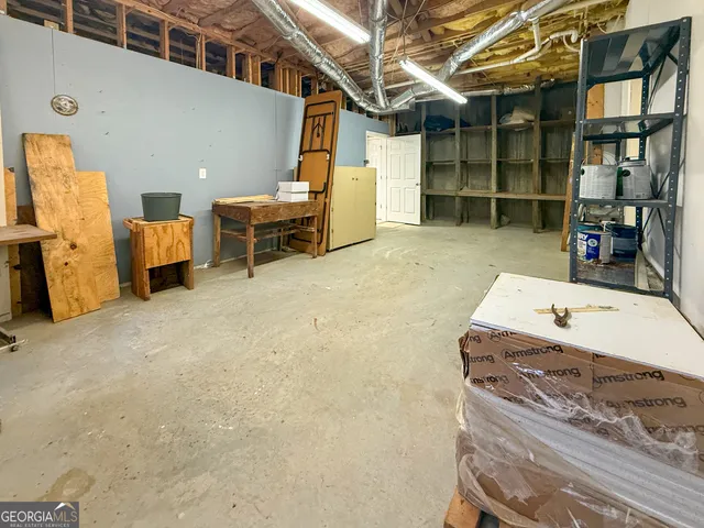 a view of a livingroom with furniture and a window