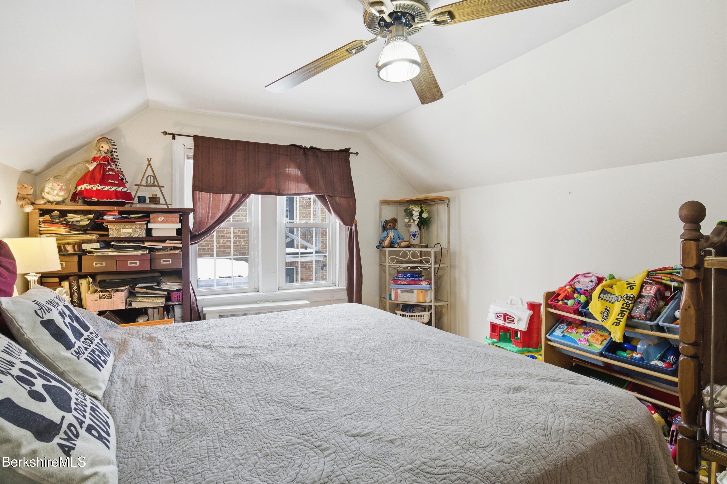 53 Edison Avenue Pittsfield, MA 01201 - Photo 23 of 45 a bedroom with a bed and a chandelier