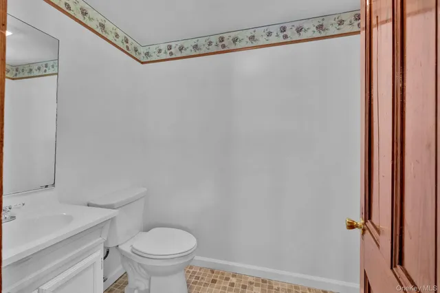 a bathroom with a shower a toilet and a sink