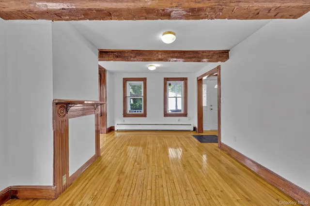 a view of a livingroom with wooden floor