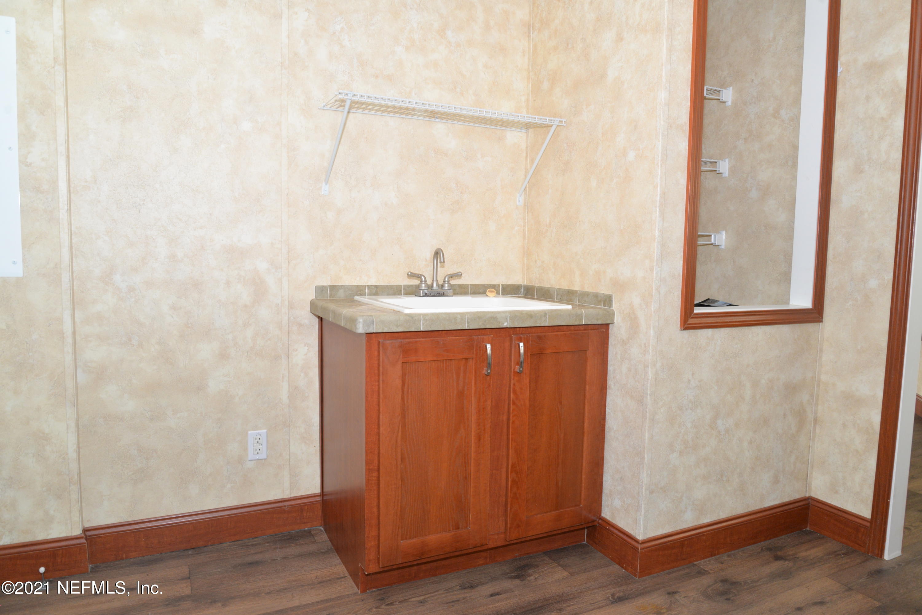 11425 Wingate Road North Jacksonville, FL 32218 - Photo 34 of 37 LAUNDRY WITH SINK AND STORAGE