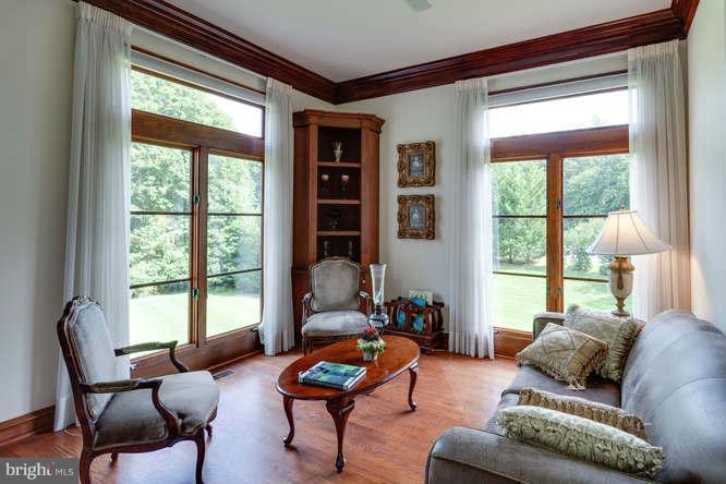 1193 Windrock Drive McLean, VA 22102 - Photo 12 of 30 a living room with furniture and floor to ceiling windows