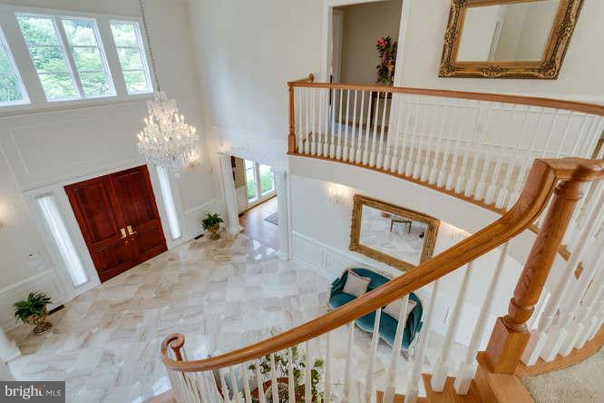 1193 Windrock Drive McLean, VA 22102 - Photo 5 of 30 a view of staircase with black carpet
