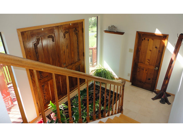 9970 Burchell Road Gilroy, CA 95020 - Photo 3 of 11 a view of a hallway with wooden floor and stairs