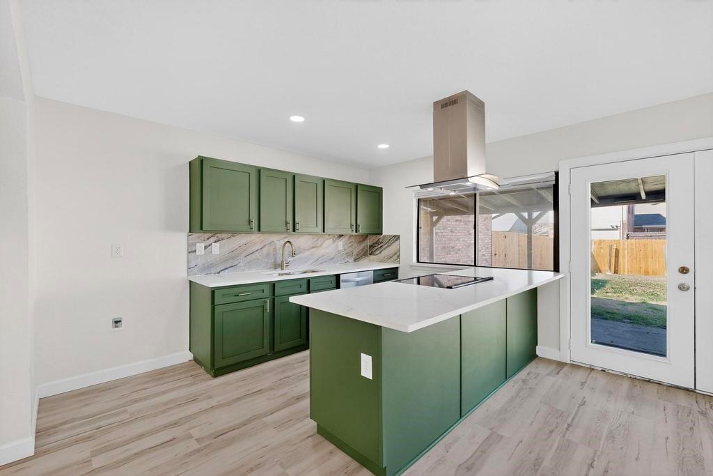8505 Woodside Road Rowlett, TX 75088 - Photo 13 of 40 a kitchen with a sink and cabinets