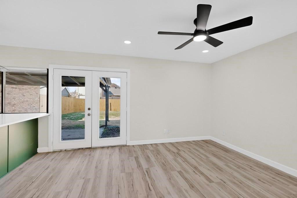 8505 Woodside Road Rowlett, TX 75088 - Photo 19 of 40 wooden floor in an empty room with a window