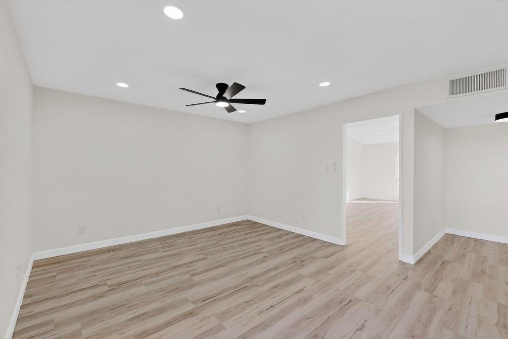 8505 Woodside Road Rowlett, TX 75088 - Photo 20 of 40 a view of a room with wooden floor and white walls