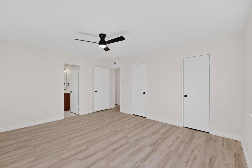 8505 Woodside Road Rowlett, TX 75088 - Photo 26 of 40 a view of room with hardwood floor and ceiling fan