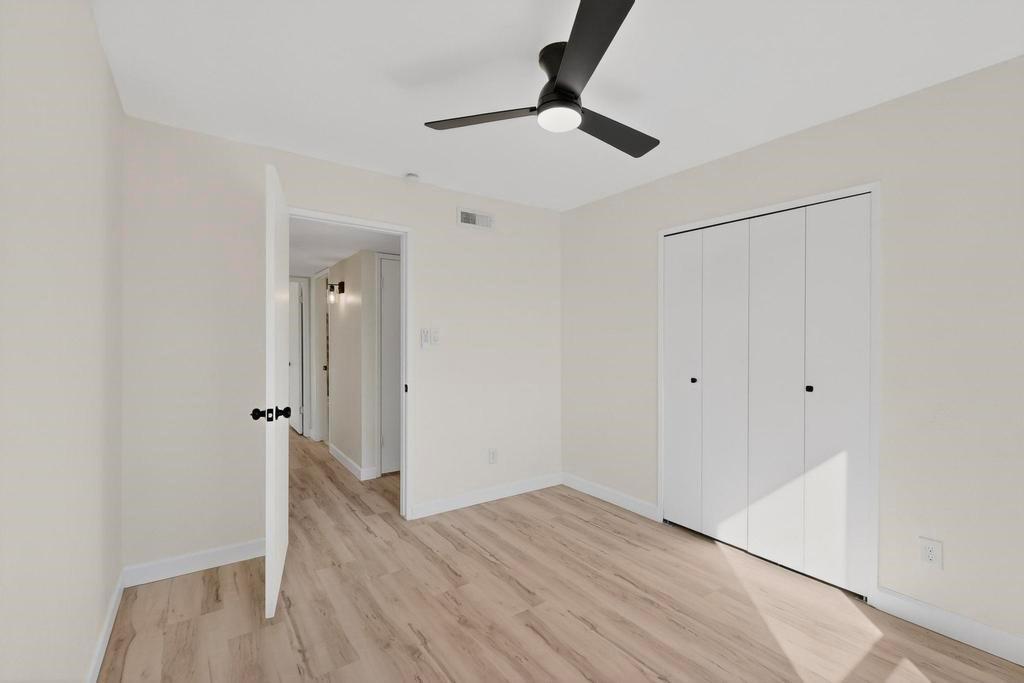 8505 Woodside Road Rowlett, TX 75088 - Photo 35 of 40 a view of a hallway with wooden floor