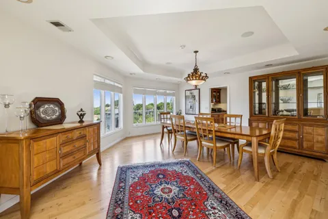 a kitchen with granite countertop cabinets and black stainless steel appliances