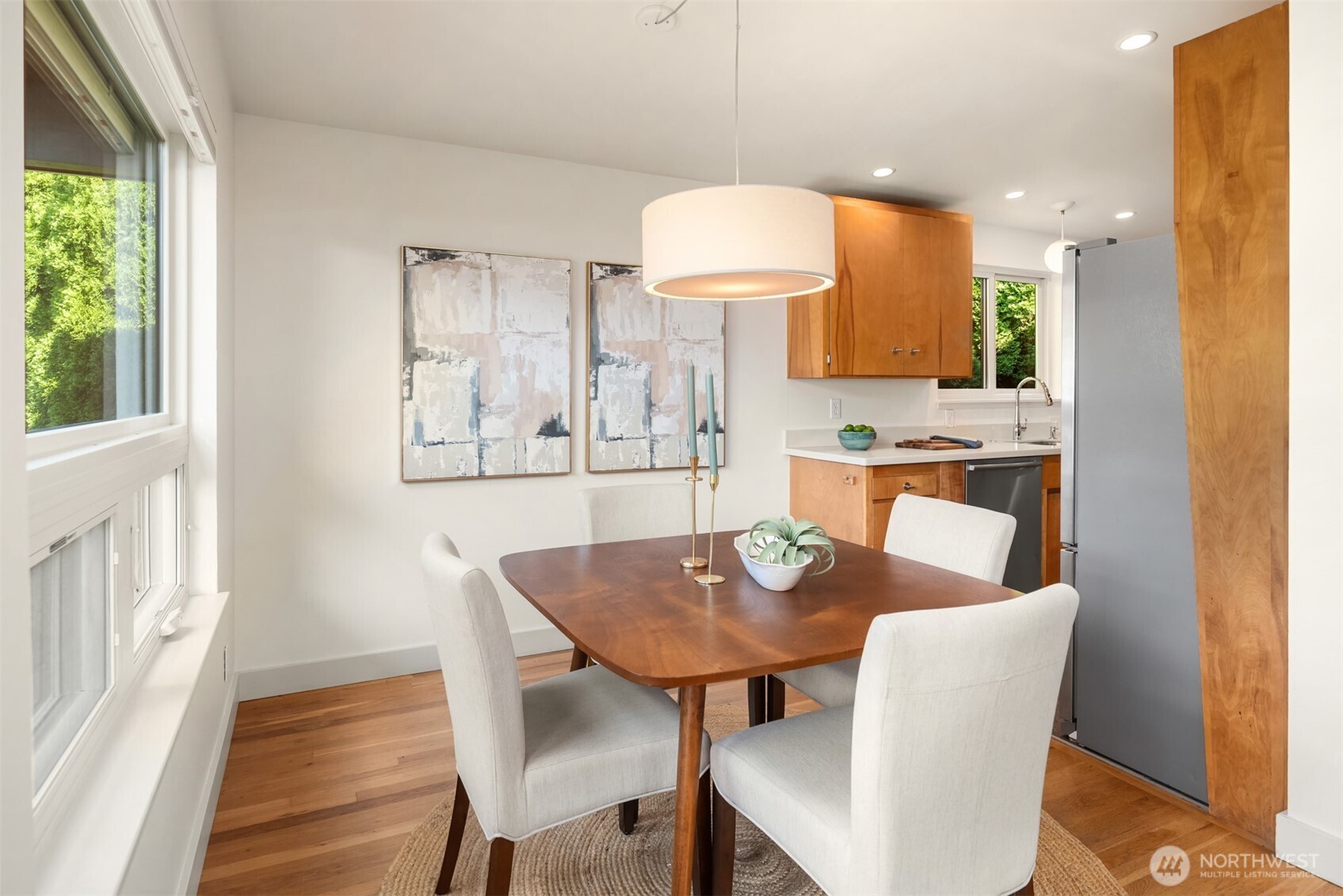 4714 50th Avenue Southwest Seattle, WA 98116 - Photo 13 of 34 a view of a dining room with furniture and wooden floor