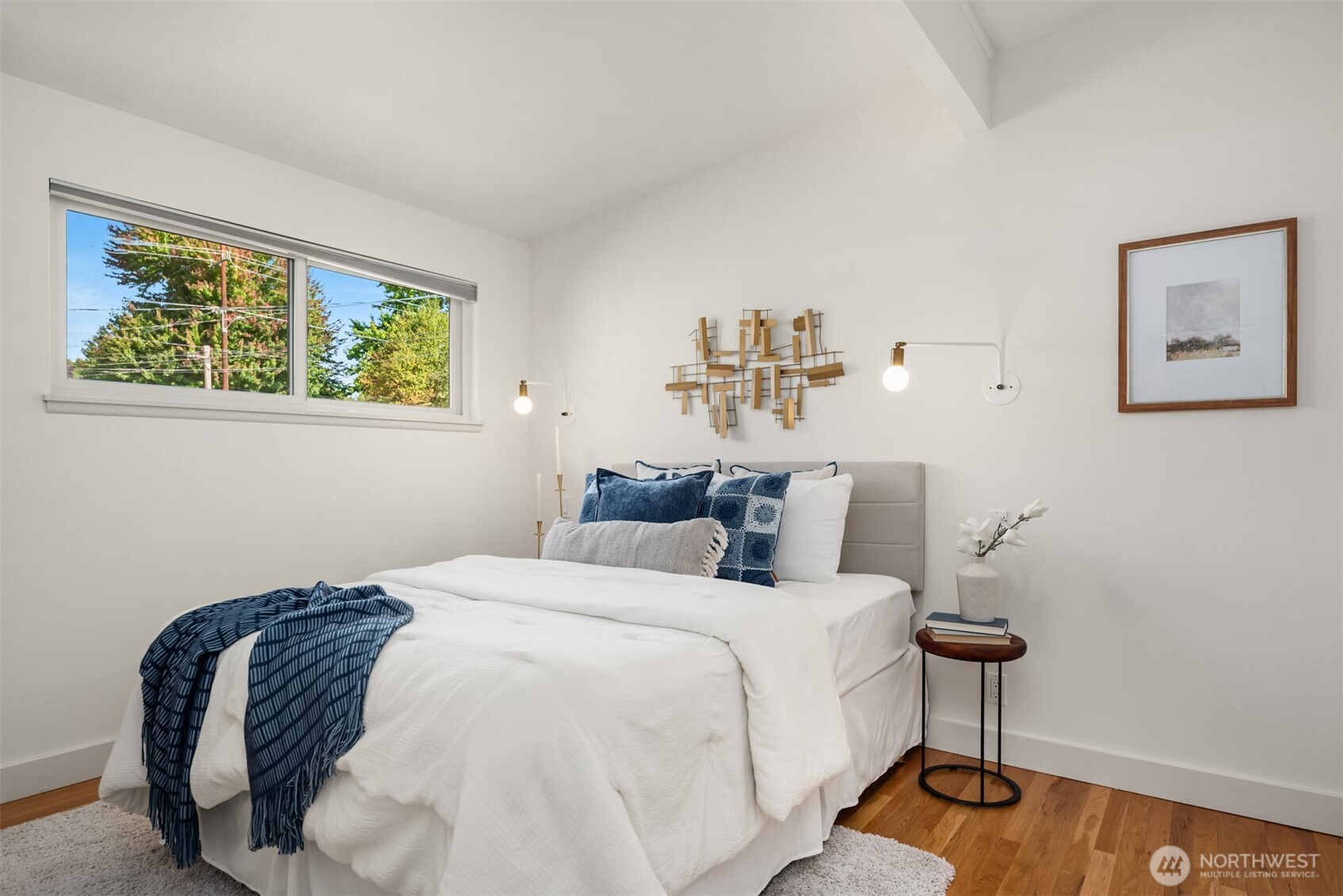 4714 50th Avenue Southwest Seattle, WA 98116 - Photo 20 of 34 a bedroom with a bed and a painting on the wall