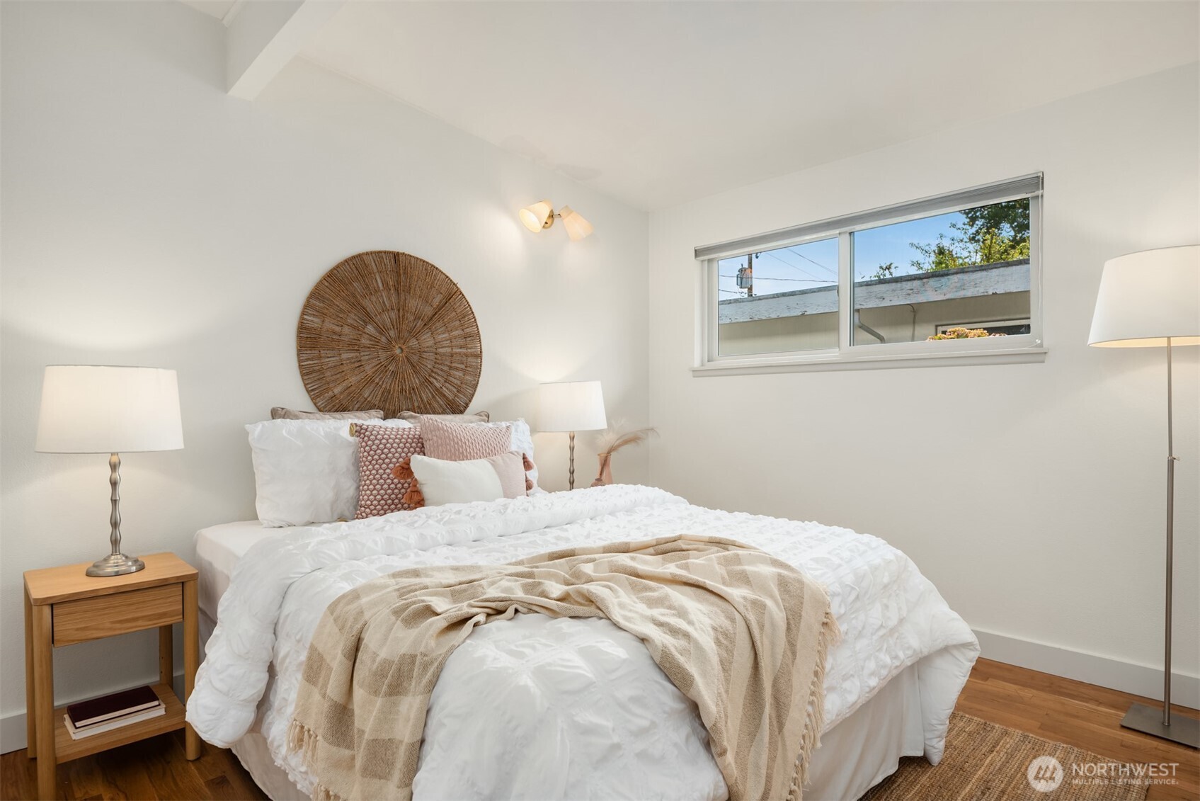 4714 50th Avenue Southwest Seattle, WA 98116 - Photo 21 of 34 a bedroom with a bed and a lamp